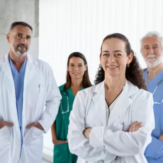 four doctors happy stand together