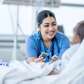 A staff man is showing a geriatric nurse from all over the world