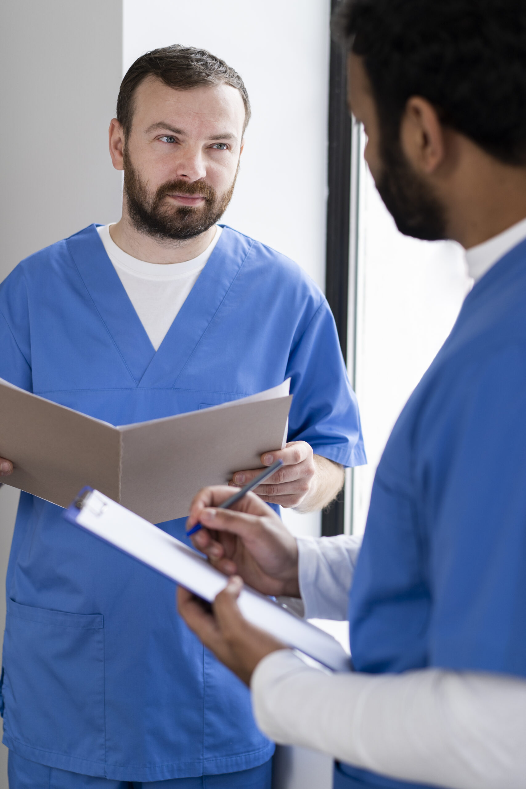 Doctor and nurse discussing about patient